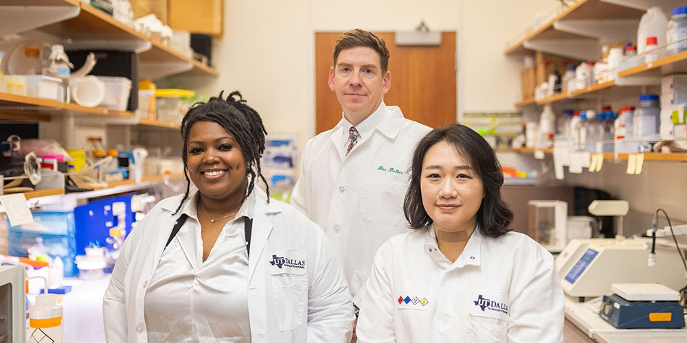 Dr. Lakeisha Lewter, Dr. Benedict Kolber and doctoral student Veronica Hong in a lab.