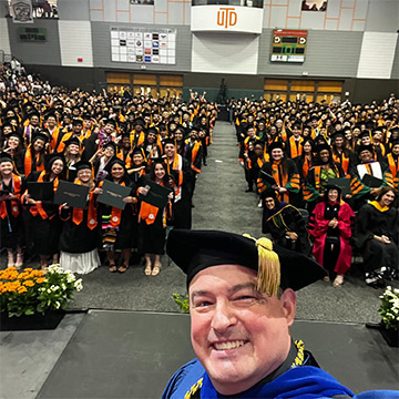 Dean Woods taking a selfie at graduation