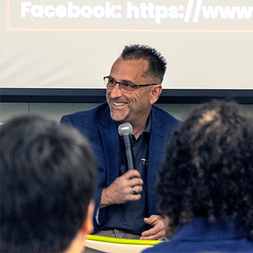 Dr. Rennaker with a microphone